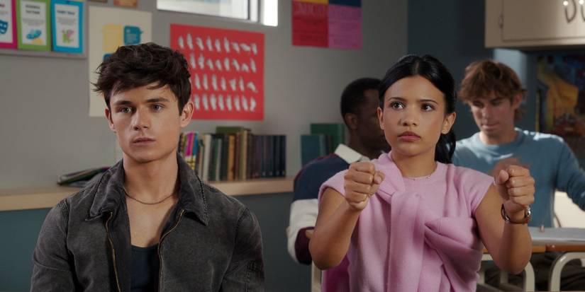 Ashby Gentry and Nikki Rodriguez in a classroom in 'My Life with the Walter Boys' Season 2.