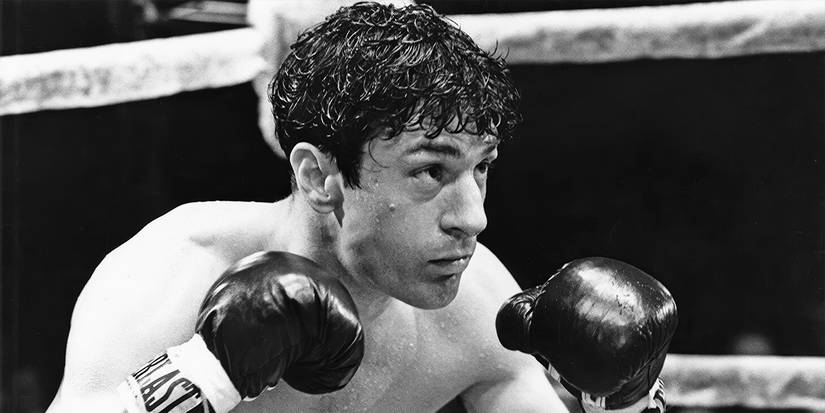 Um Jake La Motta machucado no ringue no filme Raging Bull.