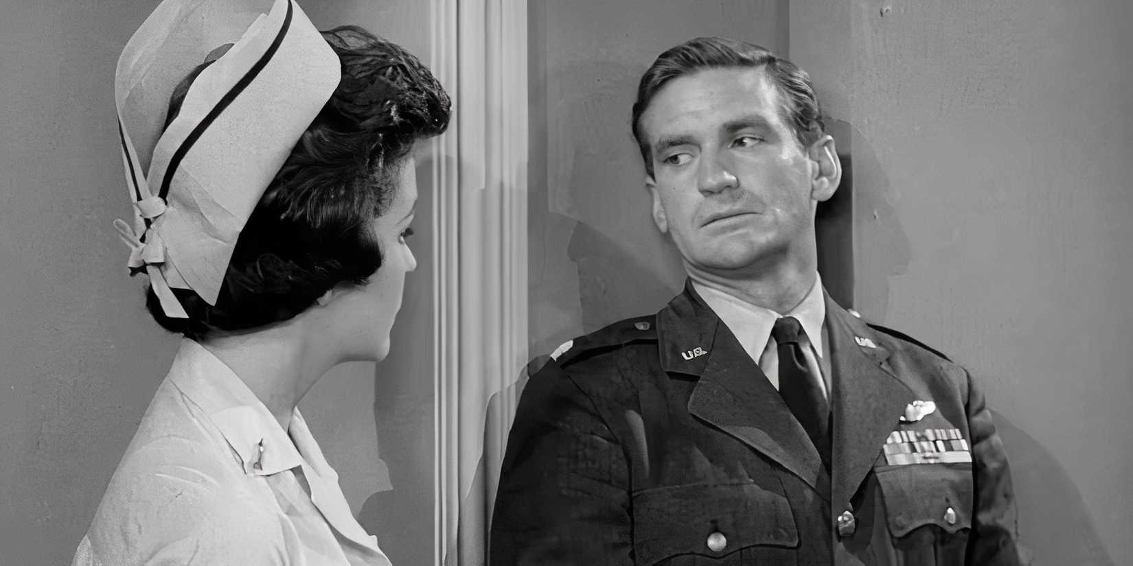 Rod Taylor with his back against a wall looking at Sue Randall who is standing in front of him in The Twilight Zone episode And When the Sky Was Opened
