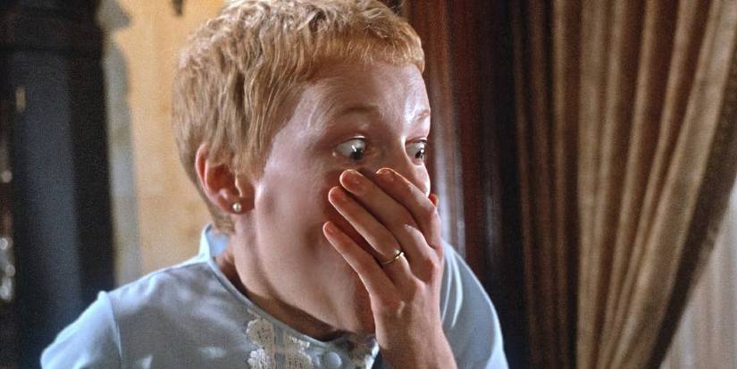Mia Farrow drowning a scream with her hand in Rosemary's Baby