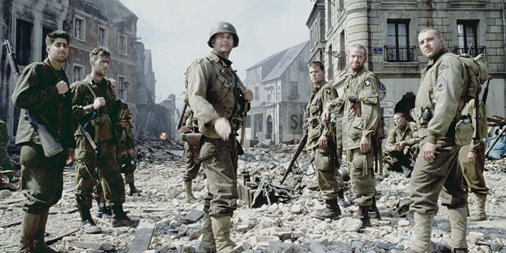 Soldiers stand in a ruined city in Saving Private Ryan, 1998.
