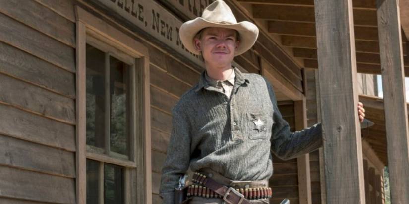 Thomas Brodie-Sangster as Whitey wearing a white hat and shirt with a star on it in 'Godless.'
