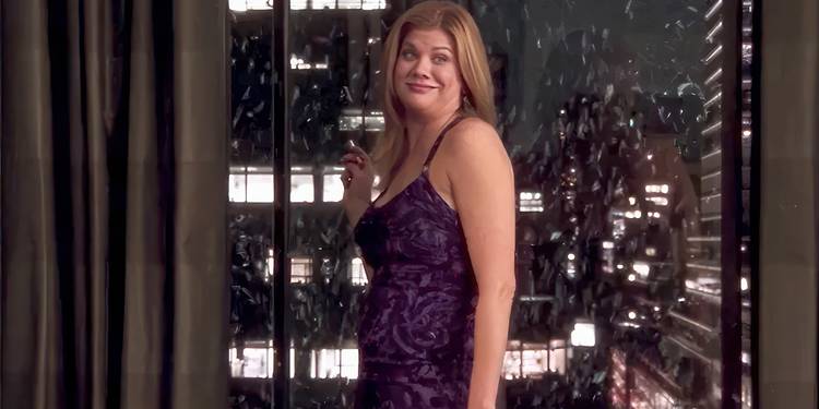 Kristen Johnston's Lexi Featherston standing by the window in Sex and the City