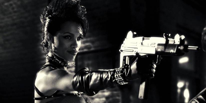 Gail pointing a gun at someone in Sin City