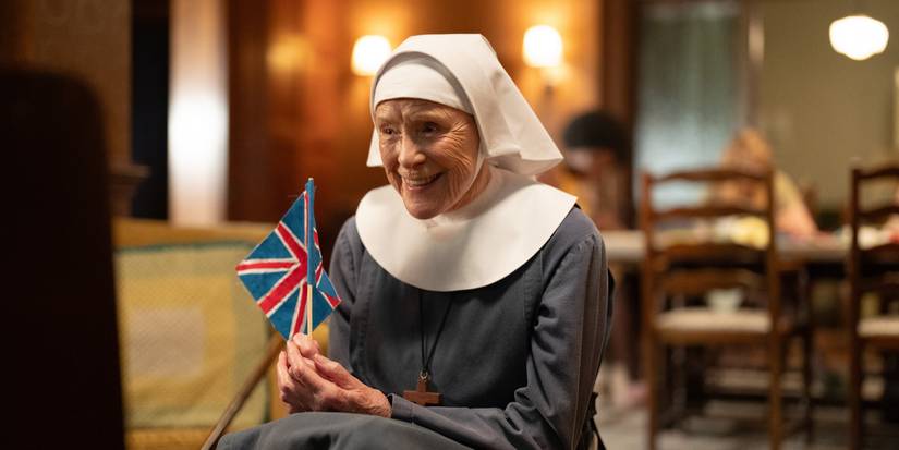 Judy Parfitt in 'Call the Midwife' Season 14 holding a little flag.
