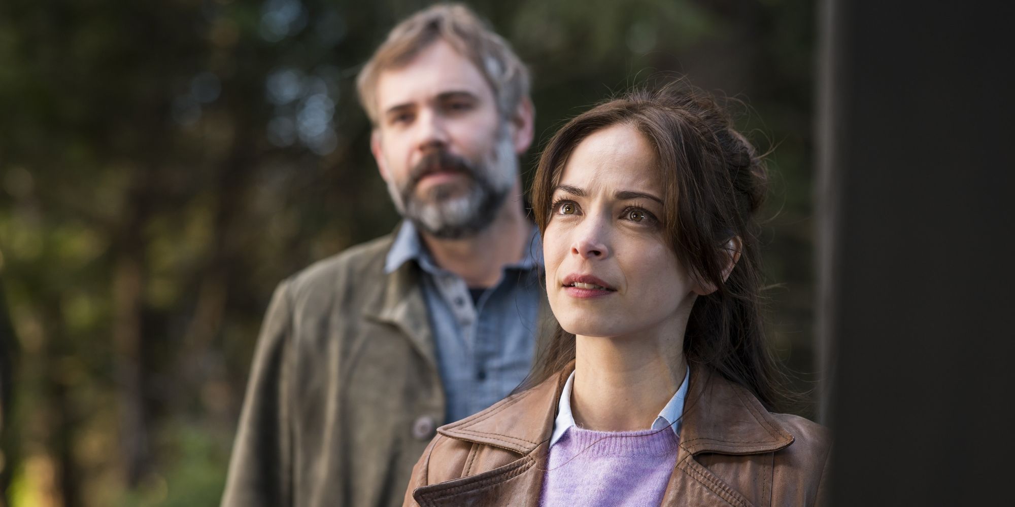 Rossif Sutherland and Kristin Kreuk standing outside in The Suspect episode of Murder in a Small Town.