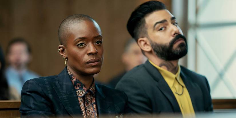 T'Nia Miller and Rahul Kohli stand in a courtroom in The Fall of the House of Usher
