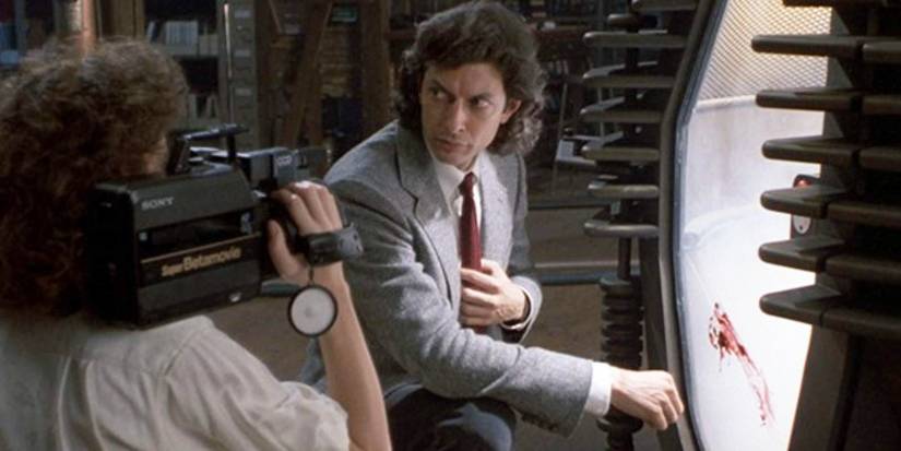 The Fly - 1986 - Jeff Goldblum is recorded while crouching near his teleportation device in a suit