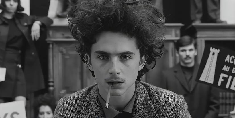 Timothée Chalamet with a cigarette in his mouth looking at the camera in 'The French Dispatch'.