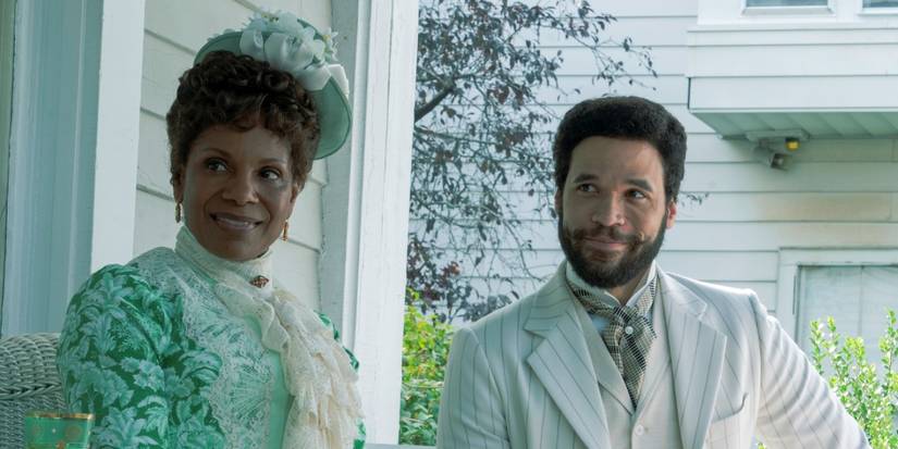 Jordan Donica as Dr. William Kirkland sitting next to Audra McDonald as Mrs. Scott in The Gilded Age