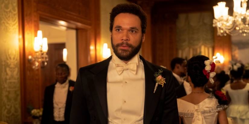 Jordan Donica as Dr. William Kirkland at a lavish ball in a tux in The Gilded Age Season 3