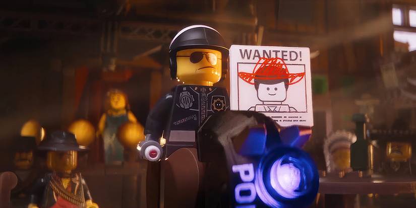 Liam Neeson's Good Cop/Bad Cop holding up a wanted sign in The Lego Movie.