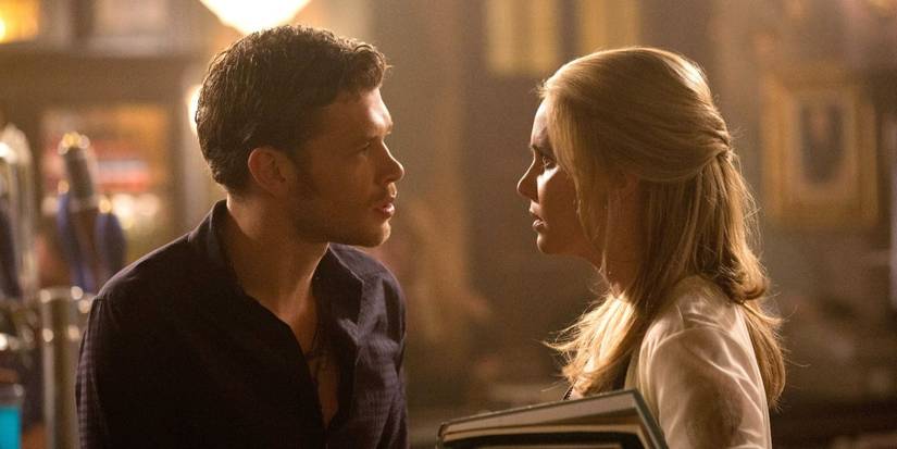 Joseph Morgan as Klaus Mikaelson and Leah Pipes as Camille O'Connor in The Originals.