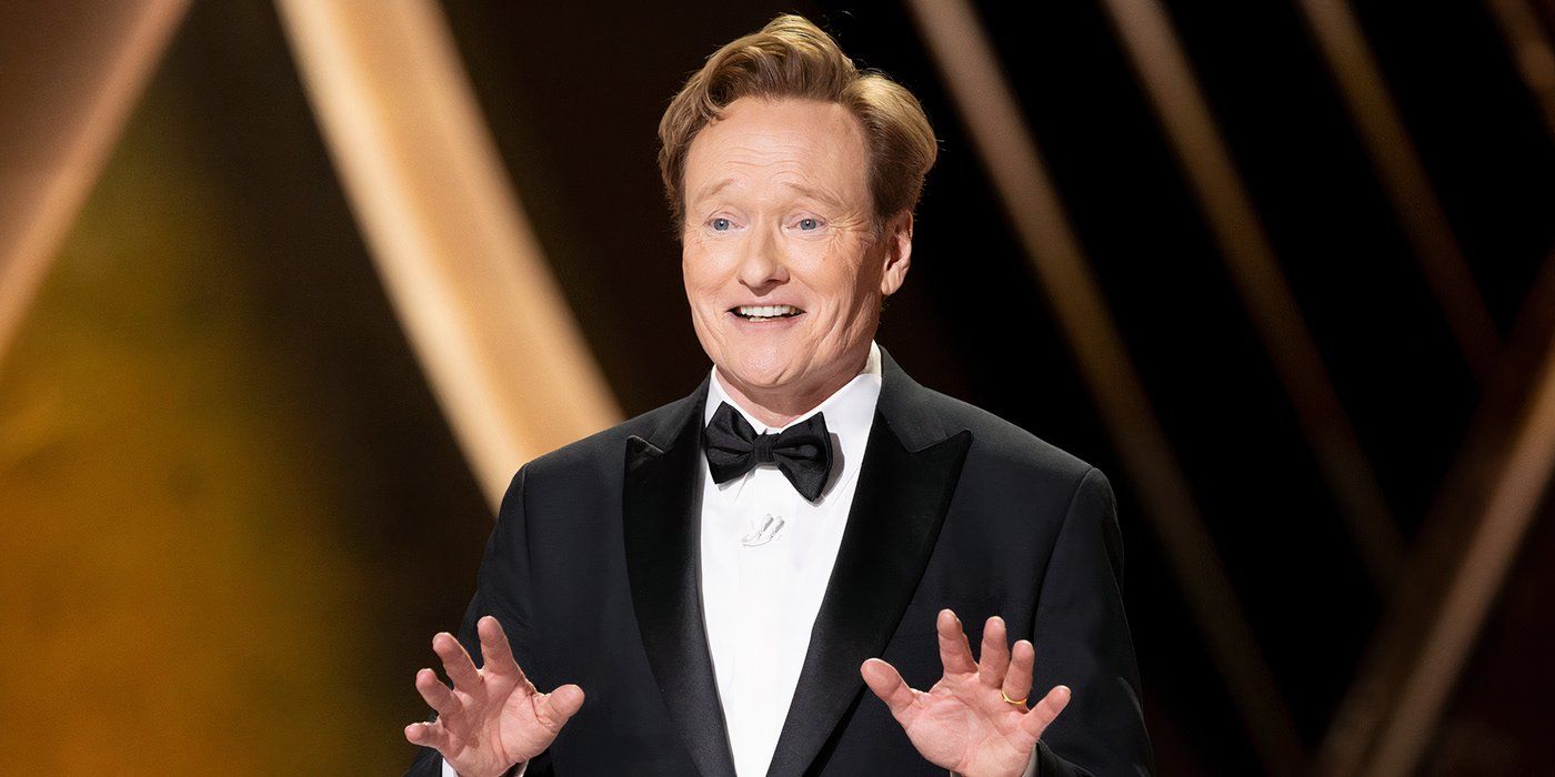 Conan O'Brien with his hands out at the Oscars