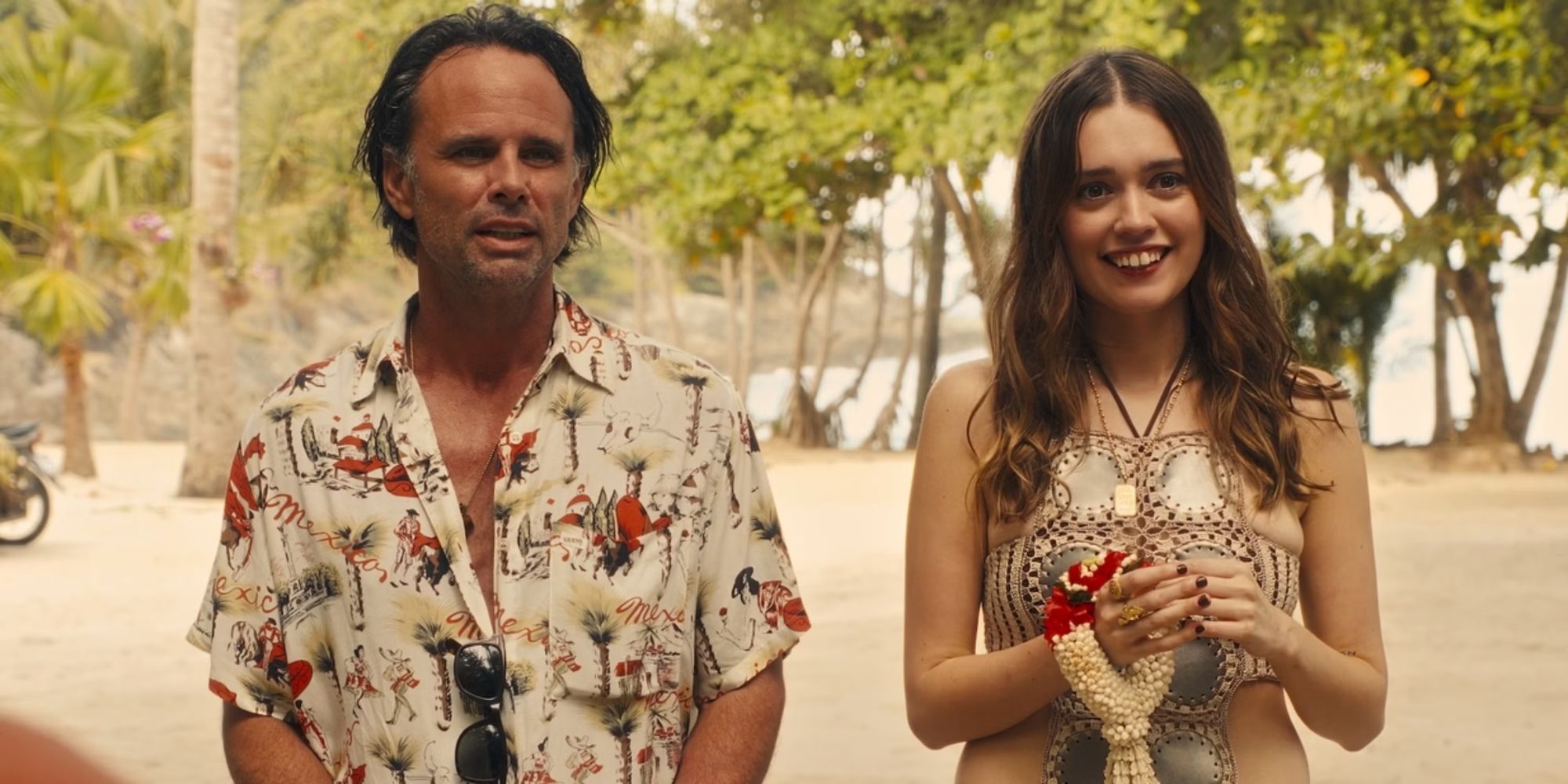 Walton Goggins as Rick standing outdoors next to Aimee Lou Wood as Chelsea in The White Lotus Season 3.