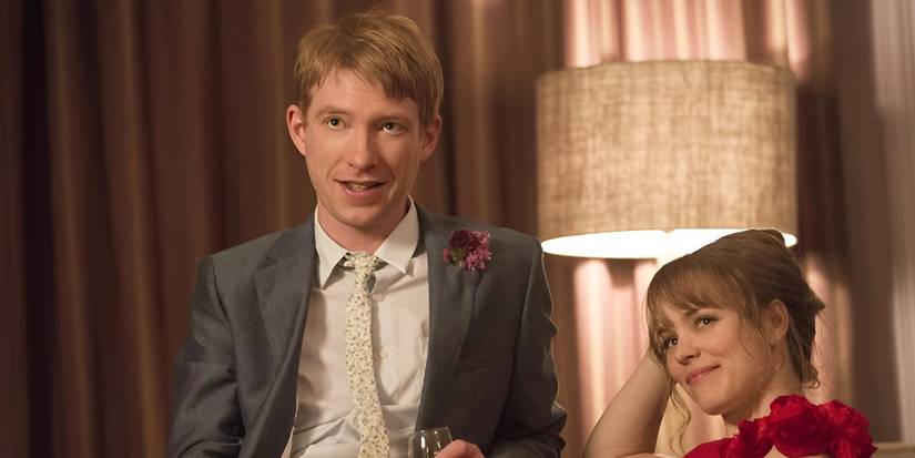Tim (Domhnall Gleeson) and Mary (Rachel McAdams) looking happy and in love at the end of their wedding in About Time.