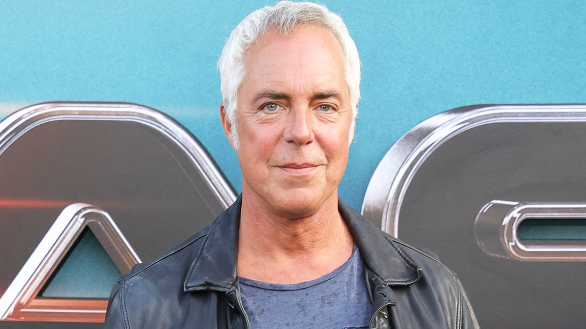 Titus Welliver smiling on the red carpet