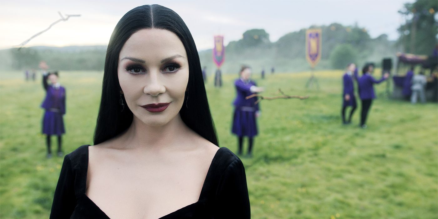 Catherine Zeta-Jones in Wednesday Season 2 looking at the camera with school kids behind her