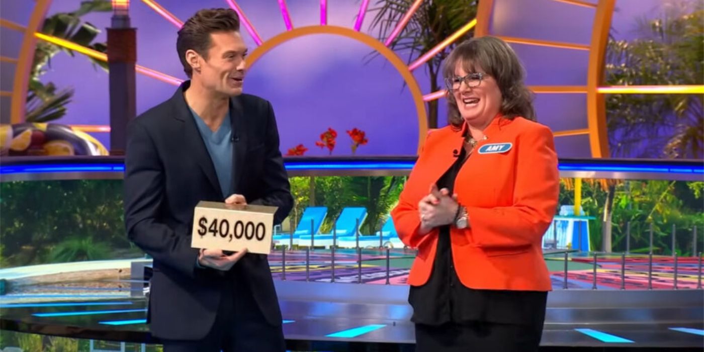Ryan Seacrest shows Amy Johnston the bonus prize during 'Wheel of Fortune.'
