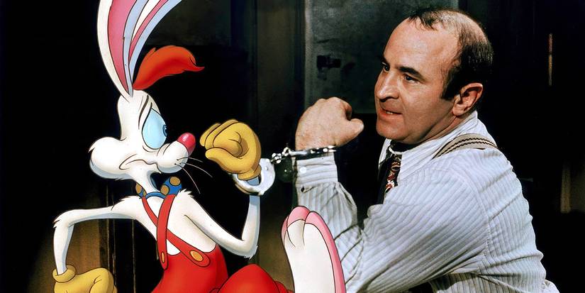 Bob Hoskins looks annoyed as he is handcuffed to Roger the cartoon rabbit in Who Framed Roger Rabbit.
