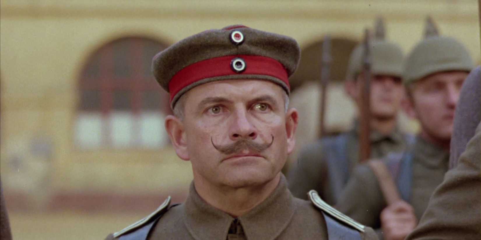 An officer with a curled mustache looks tensely ahead in All Quiet on the Western Front, 1979.