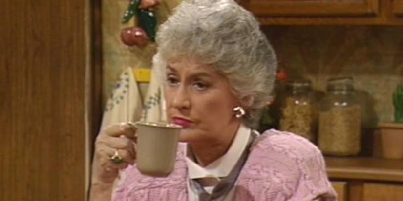 Dorothy gives a disapproving look over her cup of coffee in The Golden Girls.