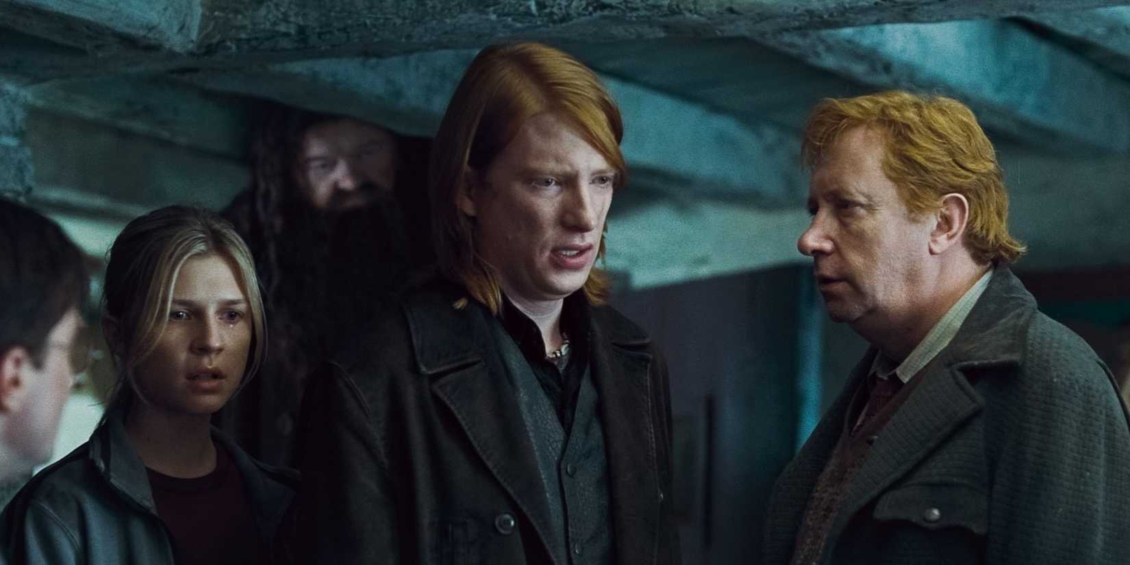 Domhnall Gleeson as Bill Weasley looks sad and talks to Arthur and Fleur in Harry Potter and the Deathly Hallows Part 1.