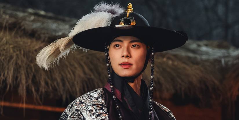 A man wearing a fancy hat in what appears to be feudal Japan in Bon Appetit, Your Majesty.