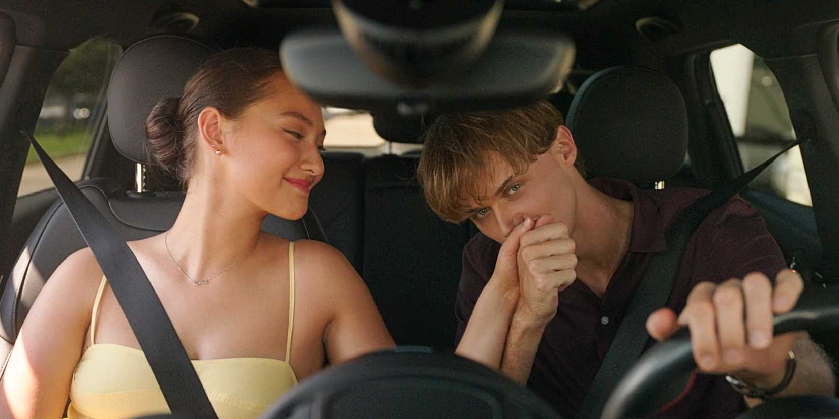 Conrad Fisher kisses Belly Conklin's hand in a car in the series finale of The Summer I Turned Pretty TSITP.