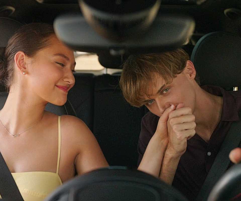 Conrad Fisher kisses Belly Conklin's hand in a car in the series finale of The Summer I Turned Pretty TSITP.