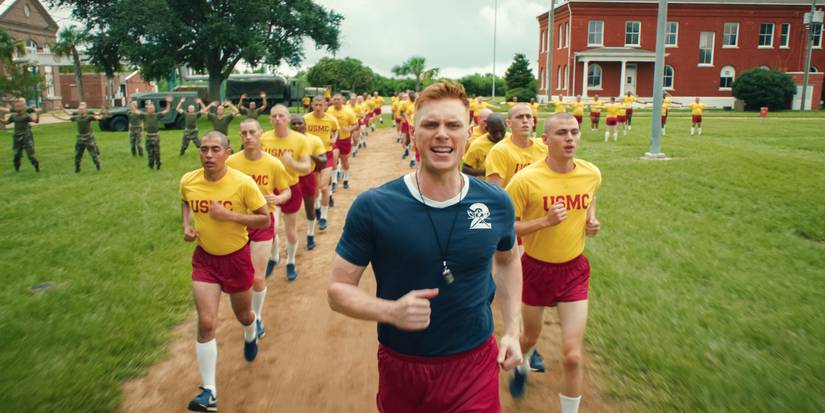 Max Parker as Sgt.Sullivan leads Miles Heizer as Cameron Cope and the cadets on a jog in Boots.