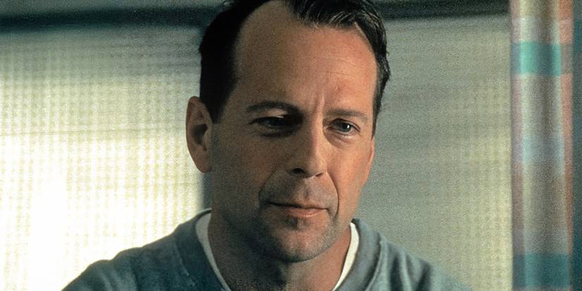 Bruce Willis looks at something off screen in 'The Sixth Sense' image