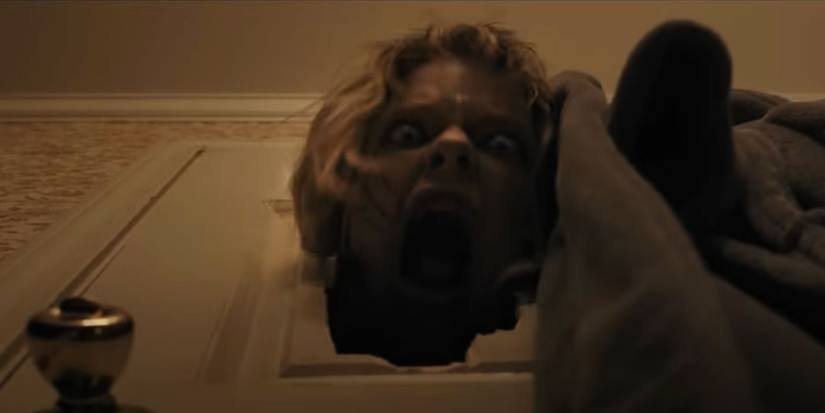 Callie Schuttera as Mrs. Lilly breaking through the bathroom door and screaming in Weapons