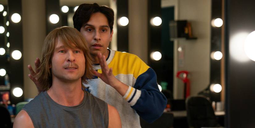 Glen Powell as Chad Powers with Frankie A. Rodriguez as Danny making sure his wig is in place in Chad Powers