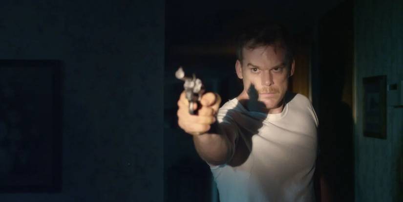 Michael C. Hall as Richard holding a gun in Cold in July.