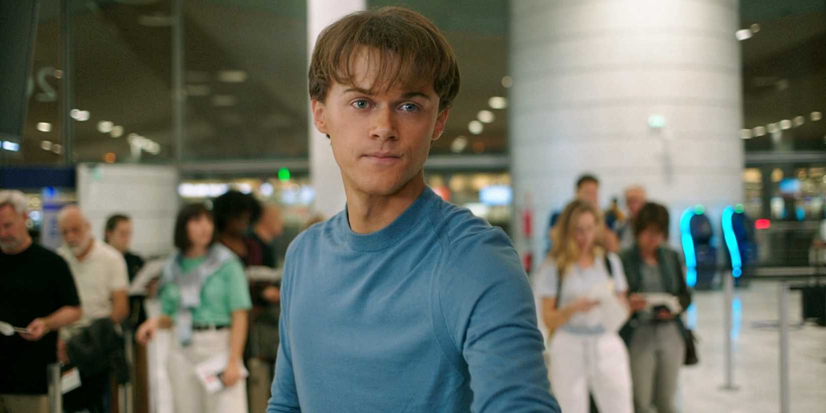 Conrad Fisher buying a ticket at an airport in The Summer I Turned Pretty TSITP Season 3