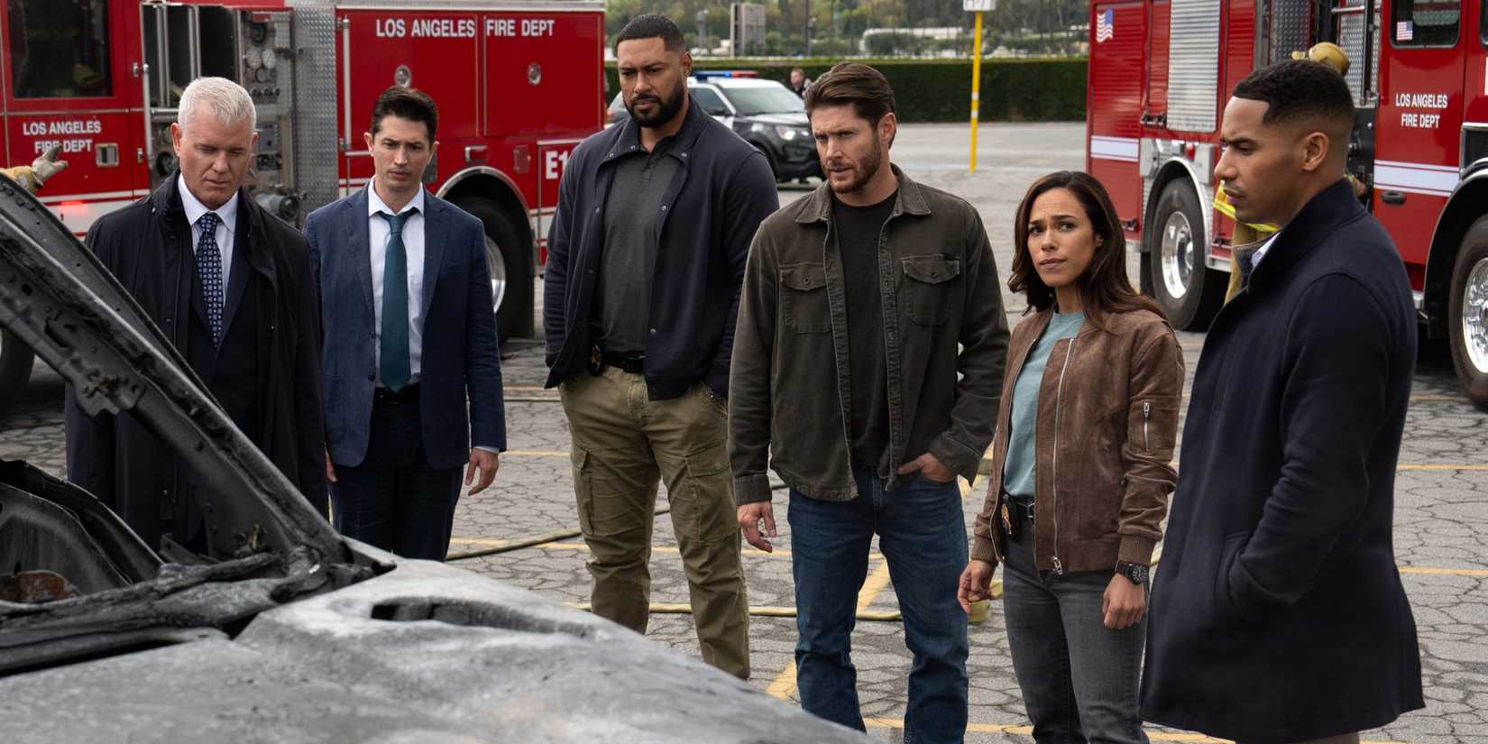 Eric Dane, Jensen Ackles, Jessica Camacho and the task force team looking at a burned car in Countdown
