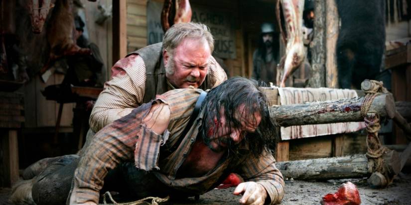 W. Earl Brown as Dan Dority and Allan Graf as Captain Joe Turner brawl on the 'Deadwood' episode 'A Two-Headed Beast.'