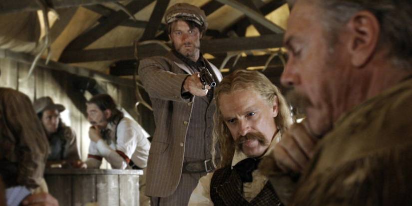 Garret Dillahunt as Jack McCall shoots Keith Carradine as Wild Bill Hickock in the 'Deadwood' episode 'Here Was a Man.'