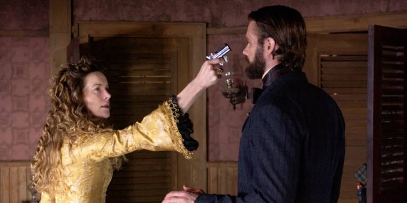 Alice Krige as Maddie points a gun at Garret Dillahunt as Francis Wolcott in the 'Deadwood' episode 'Something Very Expensive.'