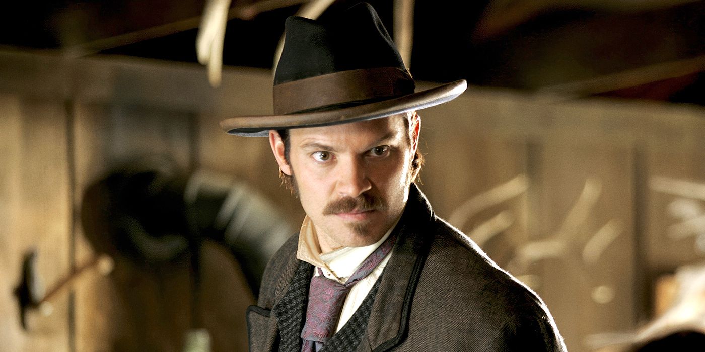 Timothy Olyphant as Seth Bullock in a hat and tie with an angry expression in Deadwood.