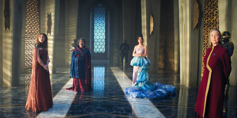 Zephyr Vorellis, Presider Kinn, Enjoiner Beryl, and Ambassador Quent in the Imperial Throne Room in Foundation Season 3 Episode 9