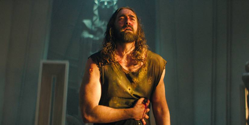 Lee Pace as Day pressing his hand to a bloody stomach wound in the Foundation Season 3 finale.