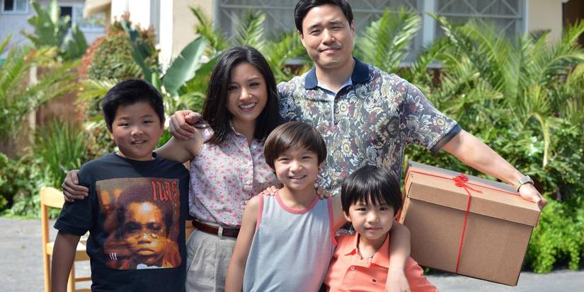 The Huang family smiles for a photo in Fresh Off the Boat.