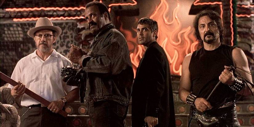 From Dusk Till Dawn - Four men standing in a bar, holding weapons ready themselves for the battle ahead