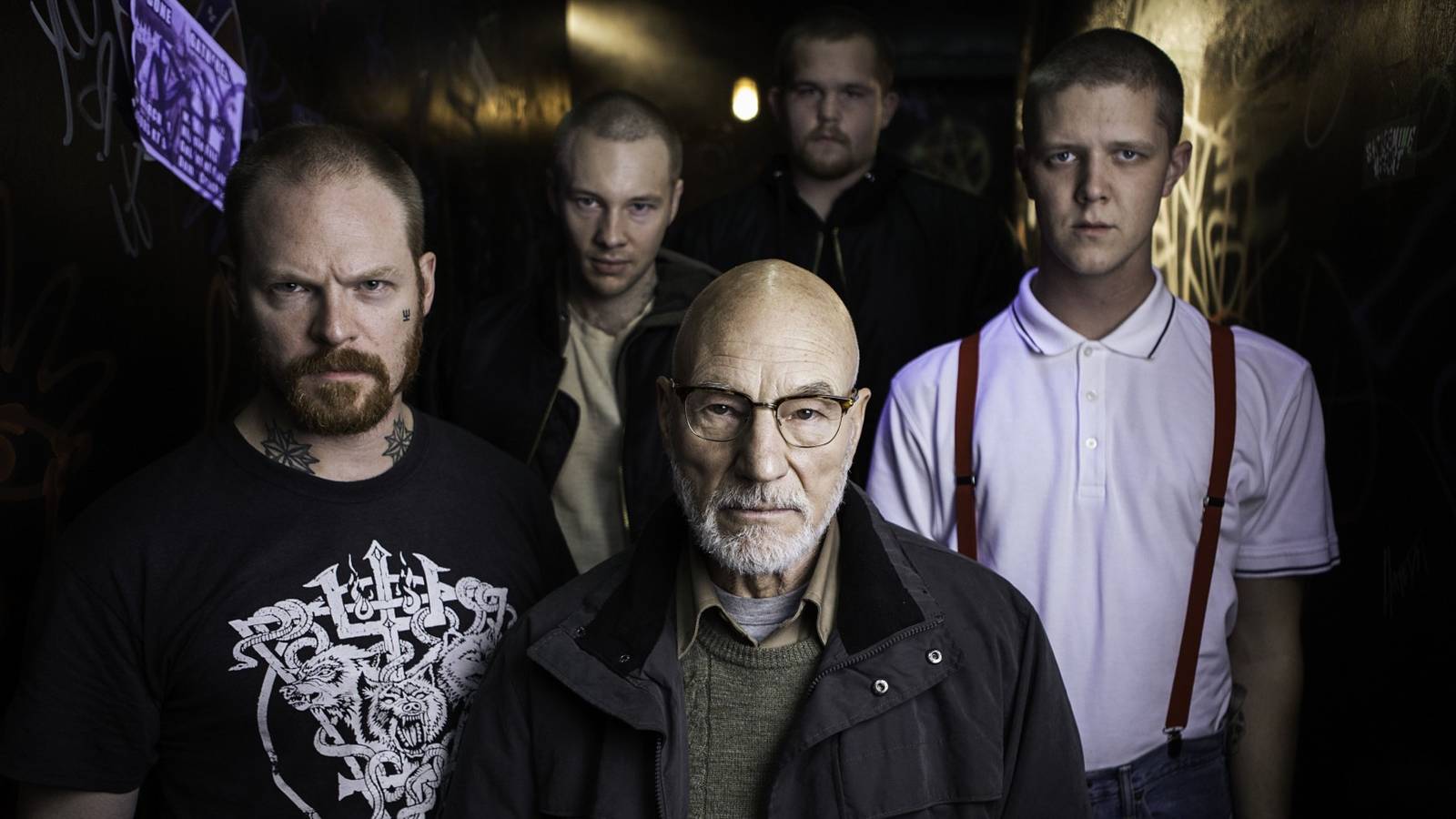 Patrick Stewart flanked by a group of neo-Nazis in Green Room