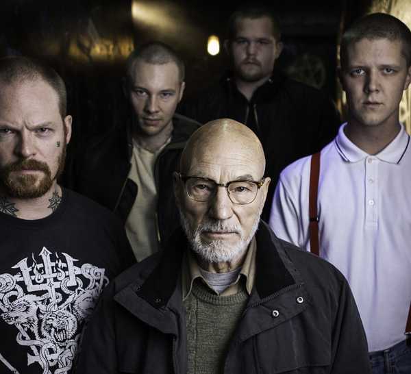 Patrick Stewart flanked by a group of neo-Nazis in Green Room