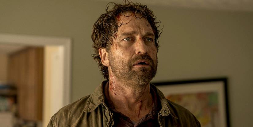 Gerard Butler as John Garrity disheveled in a living room in Greenland