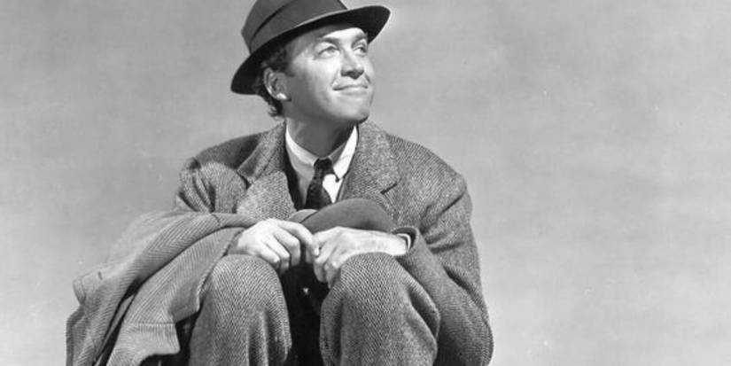 James Stewart sitting down and smiling in Harvey