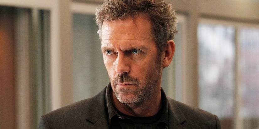 Hugh Laurie looking to the side with a serious expression in House.